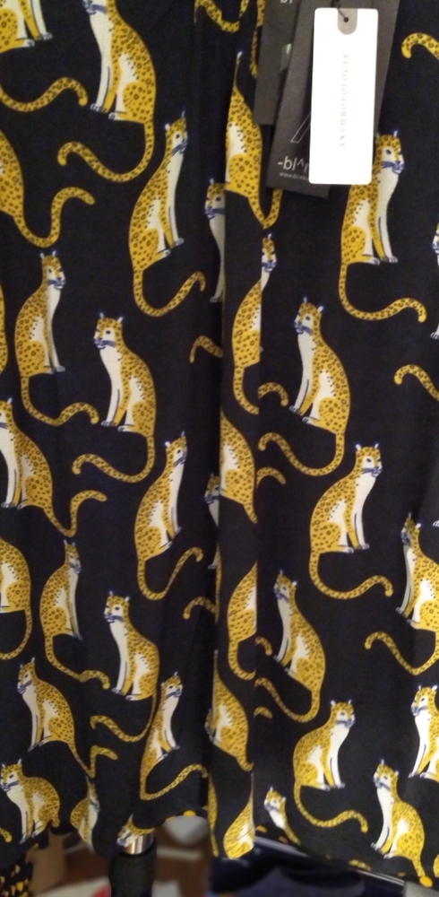 Black and mustard colored blouse with l cheetahs